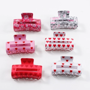 Set of 6 square claw clips with heart patterns and romantic text on white background