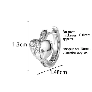 Silver heart hoop earring with engraved cross, floral patterns and white zircons