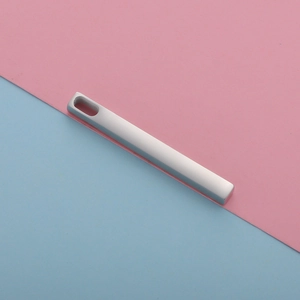 Close-up of polished stainless steel rectangle bar pendant on a dual-tone background