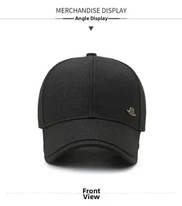 Front view of black structured baseball cap with side metal badge and curved brim