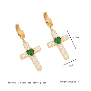Detail of gold cross earrings with green heart stones and white rhinestones, 4.5cm size