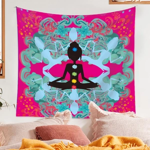 Detail view of pink chakra yoga tapestry featuring colorful mandala patterns in bedroom