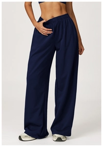 Detail view of high waist navy blue wide leg sweatpants with elastic waistband and drape