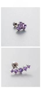 Detail display of titanium steel ear studs with purple zircon in fan and arc designs