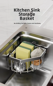 Close-up of stainless steel sponge holder with wire ball and sponges in kitchen sink