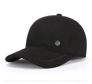 Detail view of winter baseball cap showing thick wool fabric and round FS metal logo