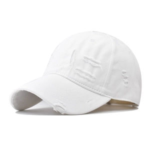 Detailed view of white distressed cotton baseball cap with vintage frayed edge details