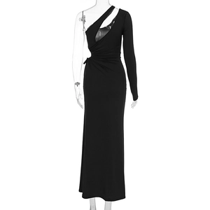 Detail of black one-shoulder maxi dress featuring waist ruching and side cut-out detail