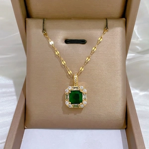 Luxury gold necklace set with square emerald pendant and shimmering zircon frame