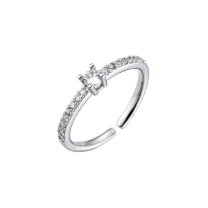 Close-up of adjustable silver ring with four-prong set cubic zirconia and pavé band