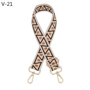 Close-up of geometric pattern strap with golden lobster clasp and adjustable buckle