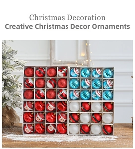 Close-up of 12-piece red and blue painted Christmas baubles in a white gift box