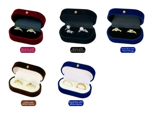 Macro view of velvet jewelry boxes with dual ring slots in various elegant colors