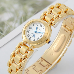 Detailed view of women's gold watch featuring Roman numerals and moon phase display