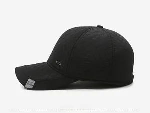 Side view of men's winter thermal baseball cap with quilted diamond pattern and sport tag