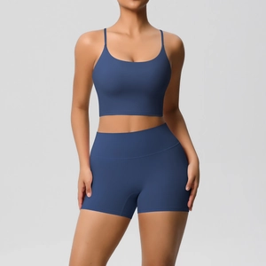 Close-up of navy yoga set featuring thin strap sports bra and high-waisted shorts