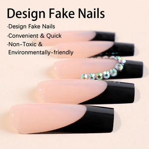 Long coffin fake nails with nude base, black french tips and rhinestone accents