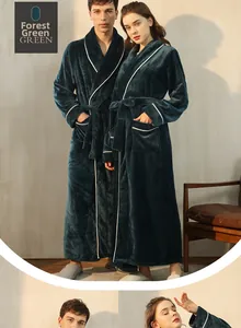 Detail of forest green flannel robe showing white piping and soft coral fleece texture