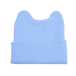 Light blue knitted beanie with cute cat ears and wide folded cuff for winter warmth