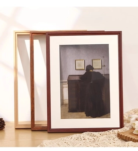 Detailed view of vintage solid wood frames in light, medium, and deep brown tones