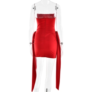 Detail of red tube mini dress back view featuring long elegant ribbons on side seams