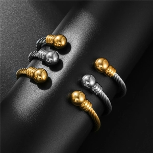 Set of five stainless steel wire cable bracelets with bead ends in gold and silver finish
