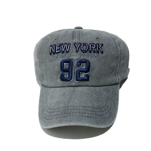 Detailed close-up of vintage New York 92 embroidery on a washed cotton grey baseball cap