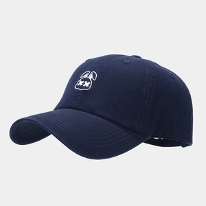 Close-up of navy blue baseball cap with white bunny embroidery and cotton twill texture