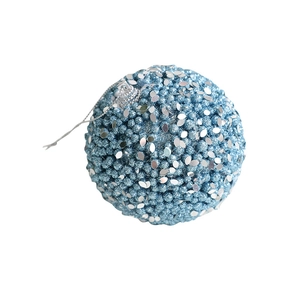 Blue beaded Christmas ornament ball with silver sequins and hanging loop on white background