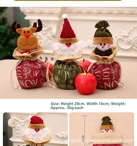 Detailed view of Christmas burlap gift bags featuring Santa, reindeer and snowman designs