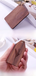 Detailed laser engraving on premium North American walnut wood keychain with golden ring