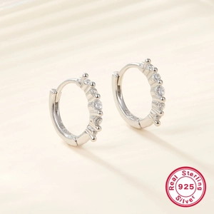 Detail view of S925 sterling silver hoop earrings with micro-paved white zircon stones