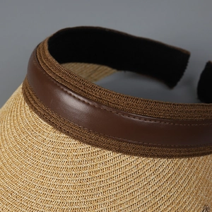 Women's summer straw top hat with wide brim, leather edge, and UV protection for beach
