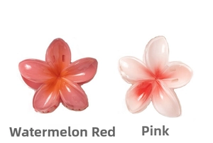 Detail view of 8cm plumeria hair claws in translucent gradient watermelon and pink resin