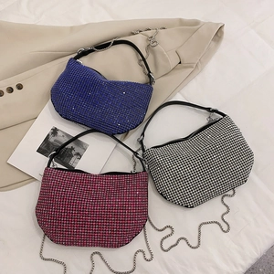 Sparkling rhinestone handbags in blue, fuchsia, and silver with metal chain straps