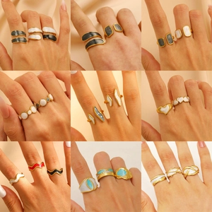 Golden heart enamel stainless steel ring set shown in multi-angle stacking view