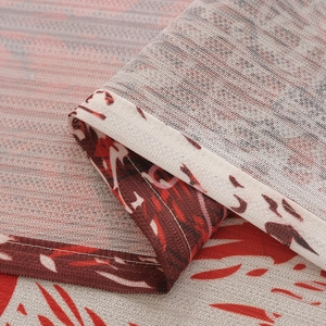 Macro shot of Nordic style red flower pattern on coarse cotton linen fabric curtain