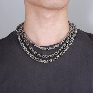 Three-layer silver dragon chain necklace for men in hip-hop style on a model