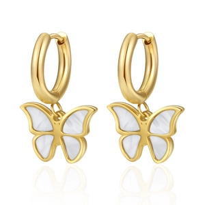 Detail shot of gold butterfly earrings with elegant white shell inlays on white background.