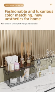 Close-up of stackable transparent gray storage bins with elegant gold metal handles