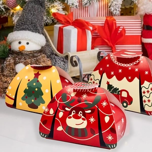 Close-up of sweater-shaped Christmas gift boxes with reindeer and tree patterns