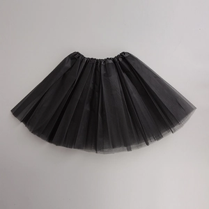 Flat lay of a layered black tulle tutu skirt with elastic waistband and A-line shape