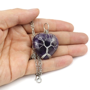 Silver wire wrapped heart-shaped amethyst tree of life necklace on a silver chain