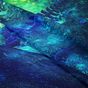 Detailed macro view of soft Bohemian mushroom tapestry with blue and green textured fabric