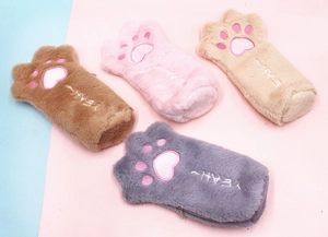 Four colorful plush cat paw pencil cases showing soft texture and embroidered details