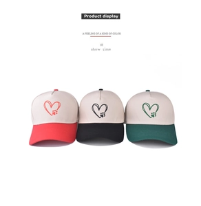 Detailed display of twill cotton baseball caps with heart and paw print embroidery