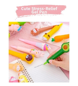 Close-up of cute cartoon squishy stress relief pens being used for writing on a notepad