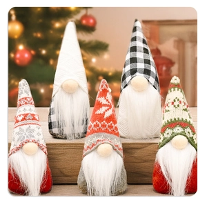 Detailed set of five Christmas gnomes with knitted hats on a wooden surface