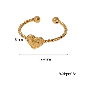 Detail of gold-plated twisted rope ring with textured heart pendant and 6mm heart charm