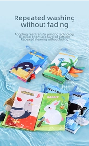 Washable baby cloth books with animal tails submerged in clear water to show durability